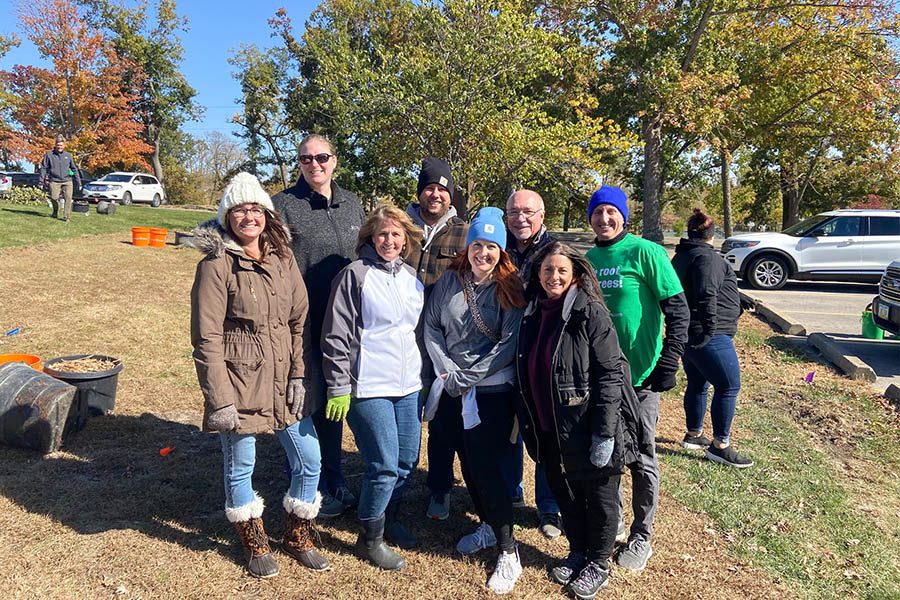 The Accel Foundation - The Accel Foundation Team Smiling and Standing Outside Posing for a Photo during a Tree Project Event