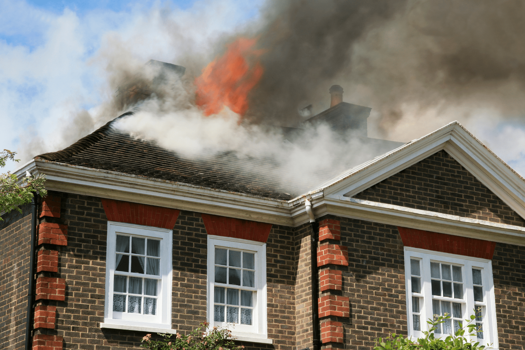 An image of a home on fire