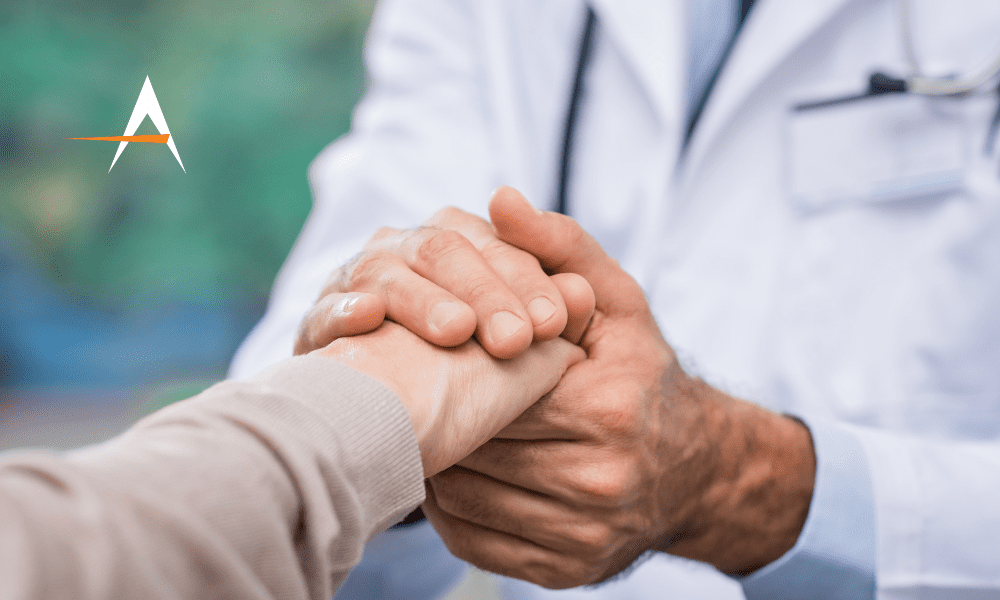 An image of a doctor and a patient shaking hands with the Accel 'A' logo
