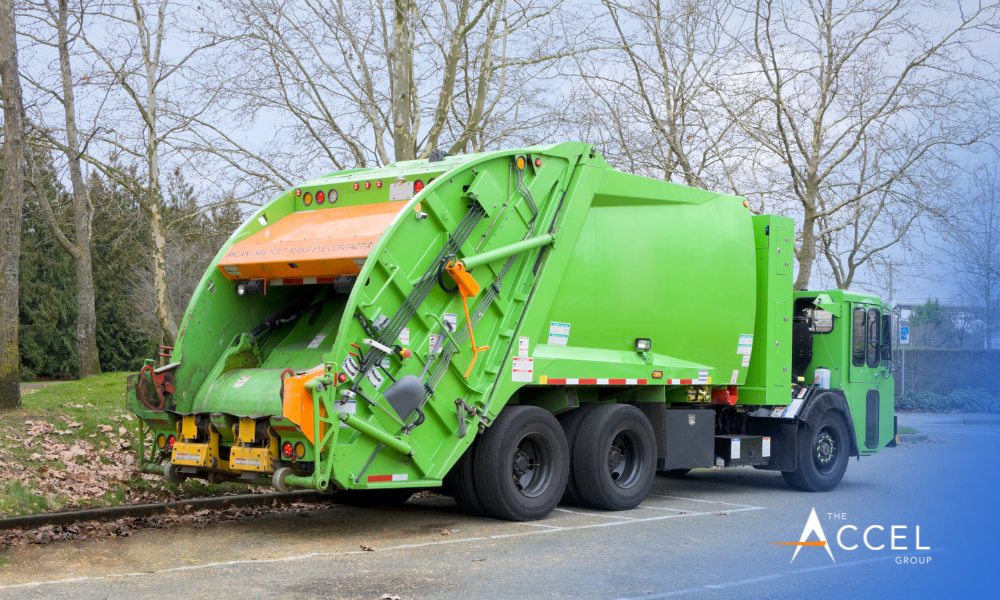 A photo with a garbage truck and The Accel Group logo